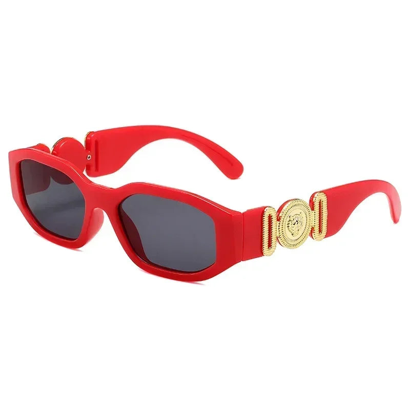 Red cat-eye sunglasses with gold medallion temples, stylish fashion accessory for women